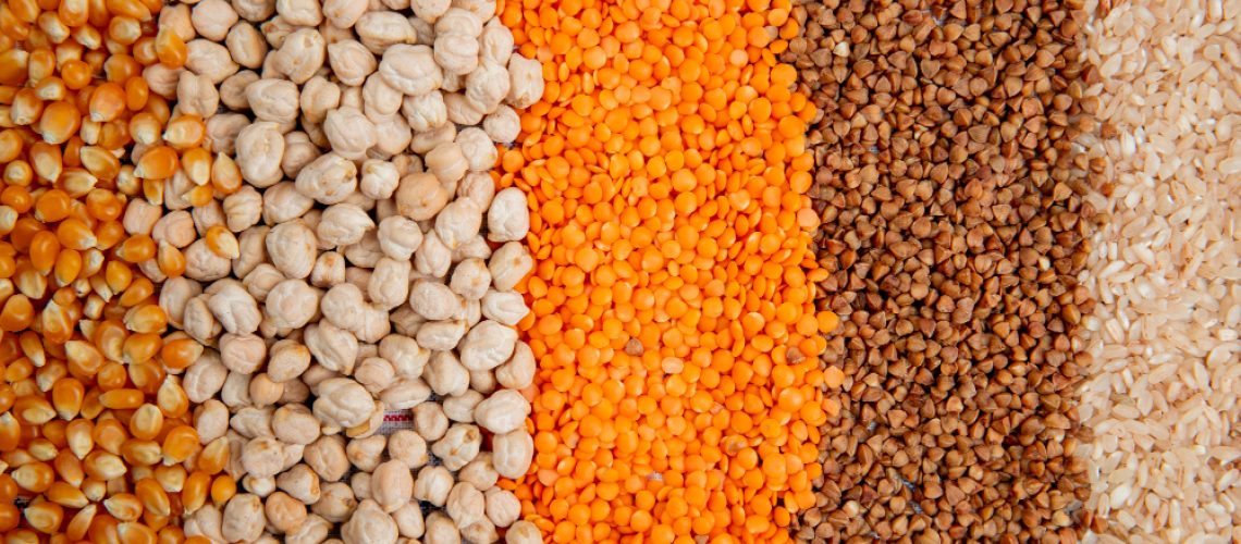 background-different-types-groats-corn-seeds-chickpeas-red-lentils-buckwheat-rice-top-view